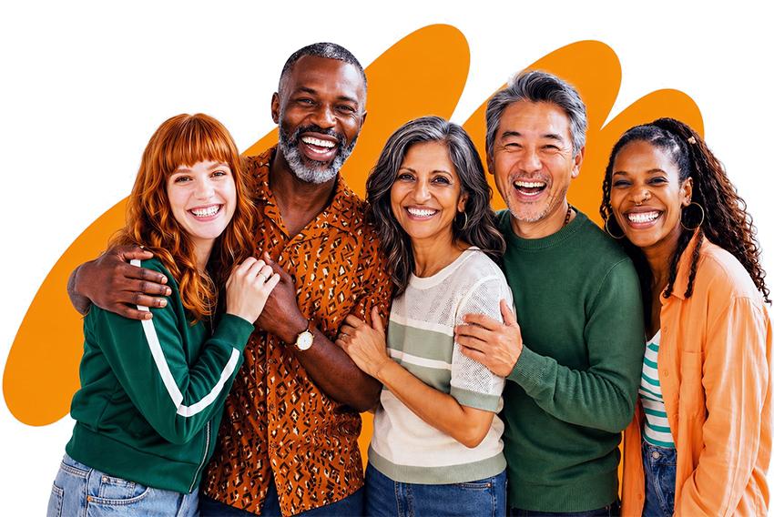 Three multicultural female friends smiling and embracing each other