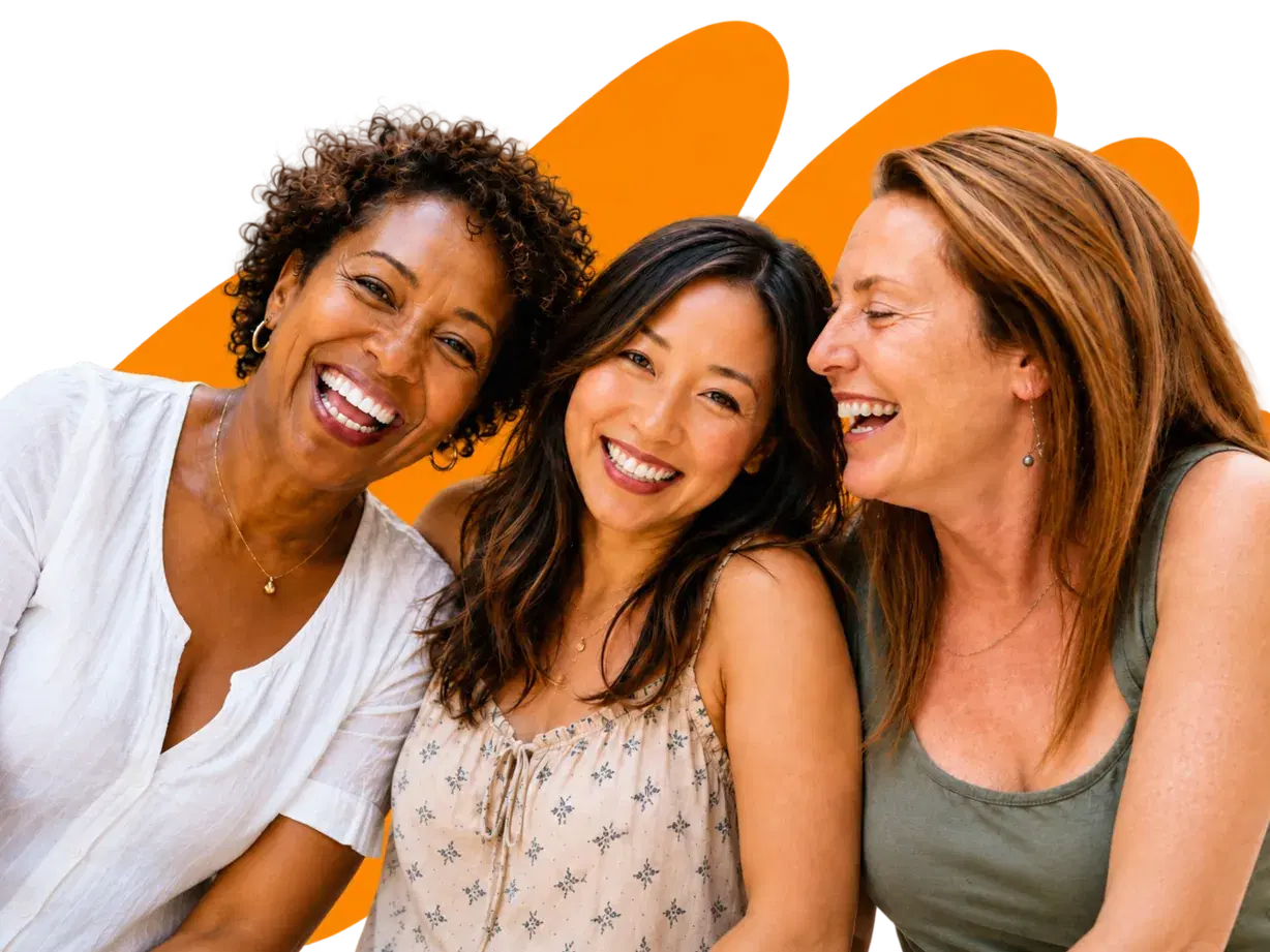 Three women laughing together
